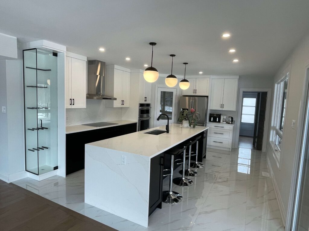 White custom kitchen with a generous island, from HJ’s existing website